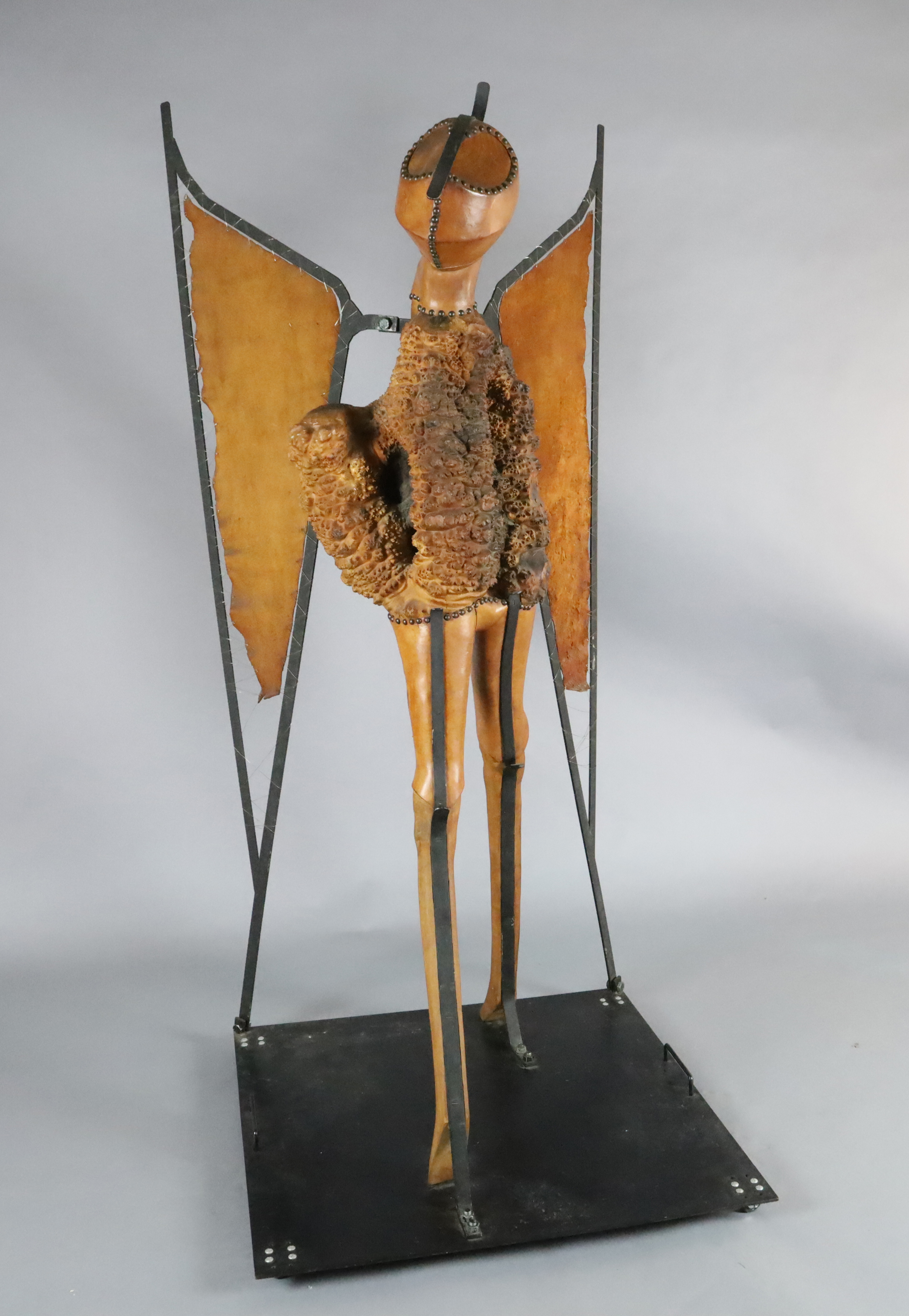Maureen Langley (1931-) South African. wood, leather and wrought iron; Locust - the Arrogance of Man H. 6ft., W.35in.